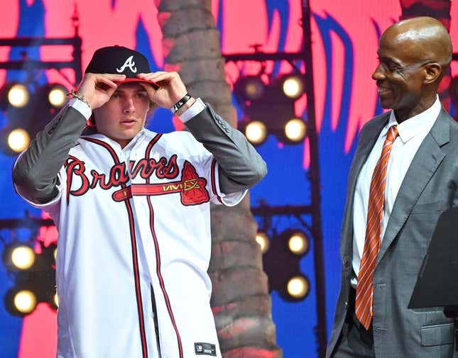 Jul 17, 2022; Los Angeles, CA, USA; Former Atlanta Braves player Fred McGriff presents JR Ritchie right with his jersey after he was selected by the Atlanta Braves as the 35th pick of the MLB draft at XBox Plaza at LA Live.