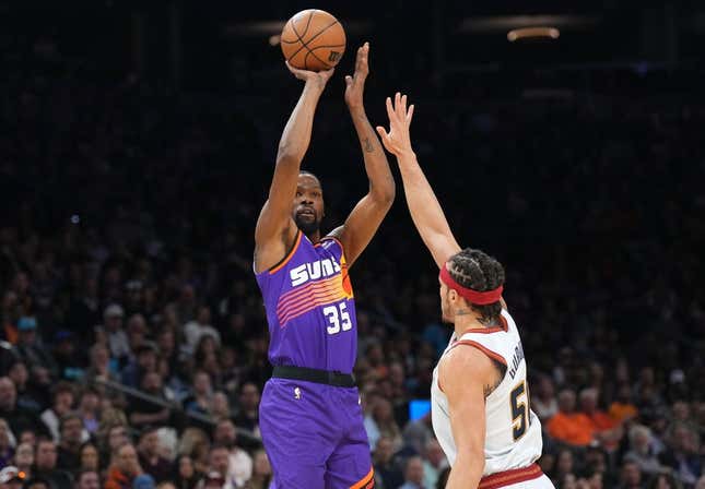 Mar 31, 2023; Phoenix, Arizona, USA; Phoenix Suns forward Kevin Durant (35) shoots over Denver Nuggets forward Aaron Gordon (50) during the first half at Footprint Center.