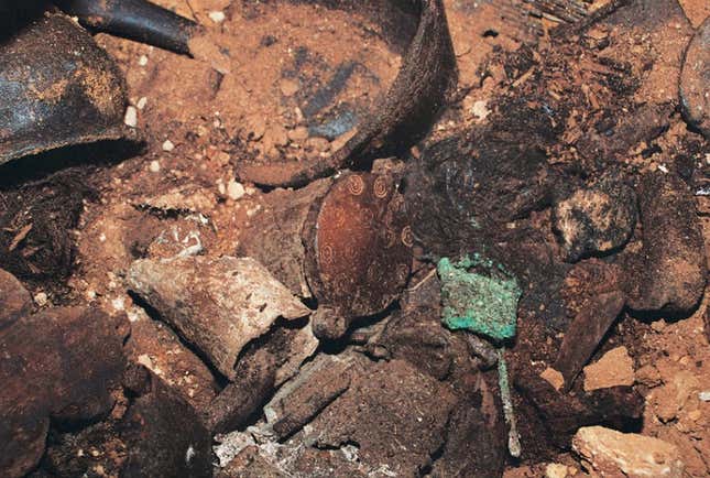 The jar containing ancient hair—note the decorations on its lid.