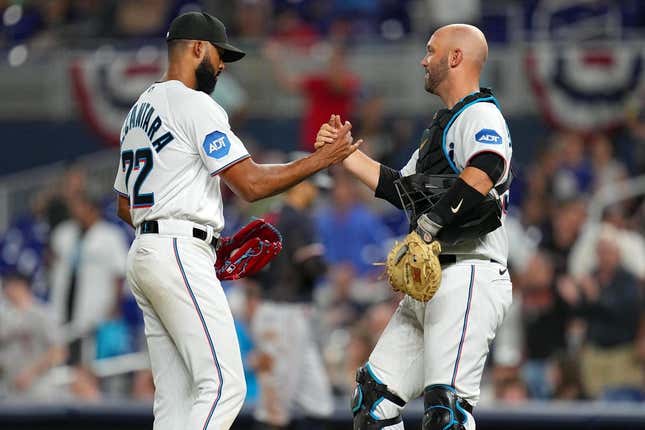 Apr 4, 2023; Miami, Florida, USA;  Miami Marlins starting pitcher Sandy Alcantara (22) shakes hands with catcher Jacob Stallings (58) after a complete game over the Minnesota Twins at loanDepot Park.