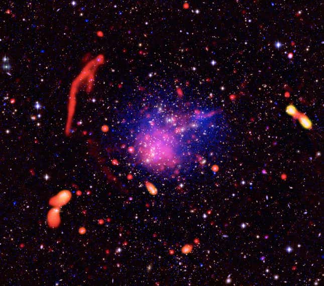 A composite image of Abell 2744 shows a galactic smattering of white, red, and purple.