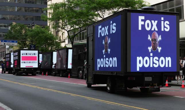 Billboard trucks from several protest groups lined the street in front of the Manhattan Center Monday during Fox New’s Upfront conference.