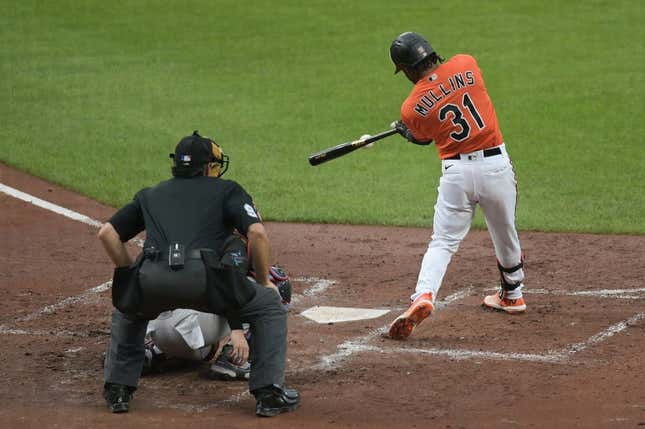 Jul 15, 2023; Baltimore, Maryland, USA; Baltimore Orioles center fielder Cedric Mullins (31) hits a rbi single scoring first baseman Ryan Mountcastle (not pictured) during the second inning  against the Miami Marlins at Oriole Park at Camden Yards.
