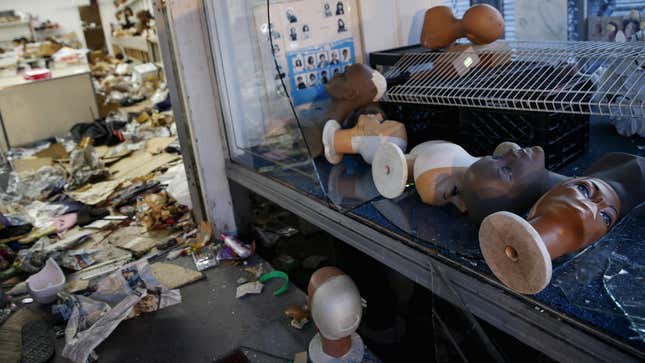 A looted wig shop, the morning after.