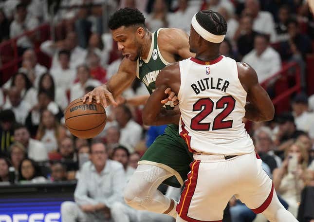 Apr 24, 2023; Miami, Florida, USA; Miami Heat forward Jimmy Butler (22) defends Milwaukee Bucks forward Giannis Antetokounmpo (34) in the first quarter during game four of the 2023 NBA Playoffs at Kaseya Center.