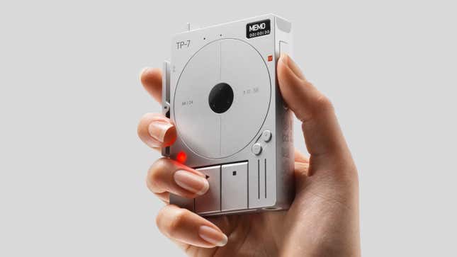 A hand holding the Teenage Engineering TP-7 Field Recorder with the thumb holding its memo record button.