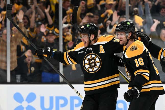 Apr 17, 2023; Boston, Massachusetts, USA; Boston Bruins right wing David Pastrnak (88) celebrates with Boston Bruins center Pavel Zacha (18) after scoring a goal against the Florida Panthers during the first period of game one of the first round of the 2023 Stanley Cup Playoffs at TD Garden.