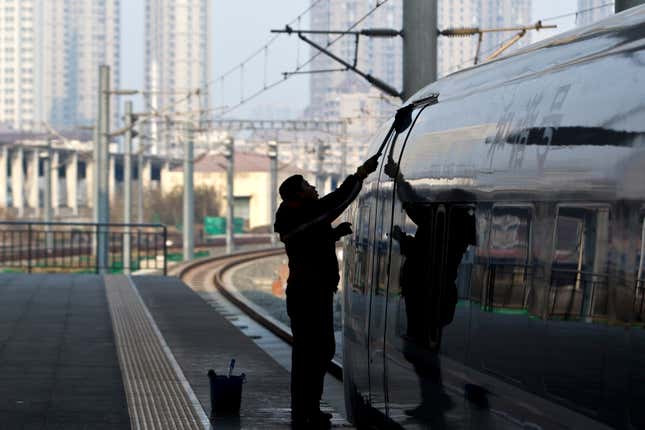 In this Tuesday Feb. 28, 2012 photo, a worker cleans exterior of a CRH high-speed train at Tianjin Railway Station in Tianjin, China. A section of a high-speed railway line that had already undergone test runs has collapsed in central China following heavy rains, the latest accident since a crash last summer that killed 40 people, state media reported Monday March 12, 2012. (AP Photo/Alexander F. Yuan)