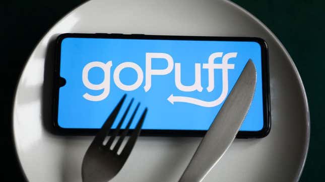 GoPuff app on phone screen on top of plate with fork and knife