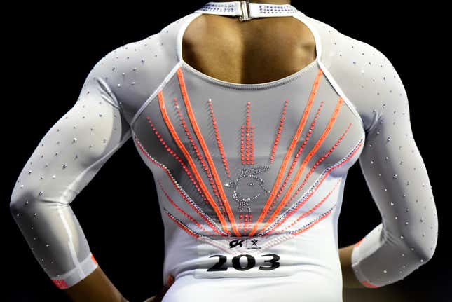 Simone Biles wears a goat made of rhinestones en route to cementing her status as the GOAT of gymnastics.