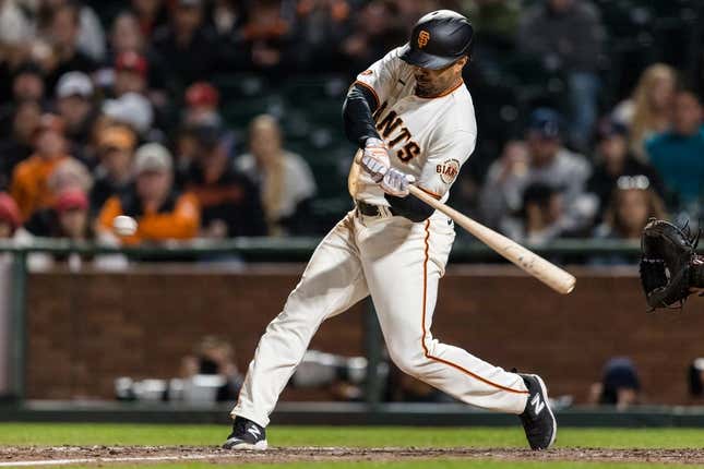 Apr 26, 2023; San Francisco, California, USA; San Francisco Giants first baseman LaMonte Wade Jr. (31) hits an RBI triple against the St. Louis Cardinals during the eighth inning at Oracle Park.