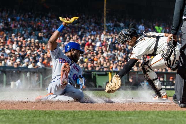 Apr 23, 2023; San Francisco, California, USA; New York Mets right fielder Starling Marte (6) slides home to score in front of San Francisco Giants catcher Blake Sabol (2) during the third inning at Oracle Park.
