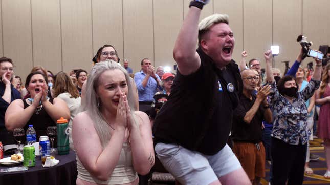Abortion supporters Alie Utley and Joe Moyer (R) react to the failed constitutional amendment proposal at the Kansas Constitutional Freedom Primary Election Watch Party in Overland Park, Kansas on August 2, 2022.