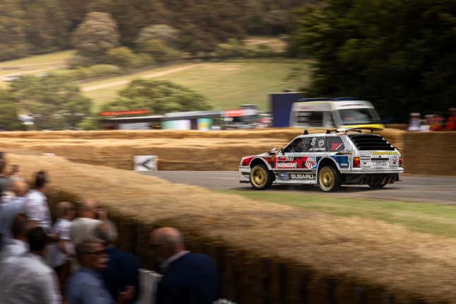 The 1983 Subaru GL "Family Huckster" runs up the hill at the 2023 Goodwood Festival Of Speed