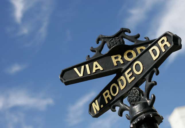 This picture shows a road sign of Via Rodeo and North Rodeo Drive in Beverly Hills on October 29, 2010. Rodeo Drive is one of the most exclusive shopping streets in the world.