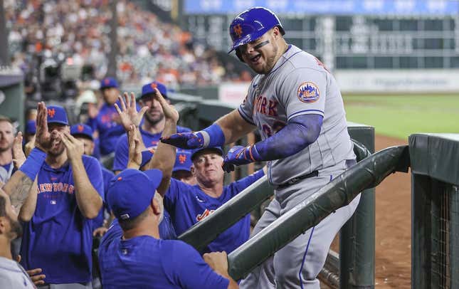 Jun 19, 2023; Houston, Texas, USA; New York Mets designated hitter Daniel Vogelbach (32) celebrates with teammates after hitting a home run during the third inning against the Houston Astros at Minute Maid Park.