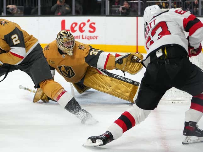 Mar 3, 2023; Las Vegas, Nevada, USA; Vegas Golden Knights goaltender Adin Hill (33) makes a save against New Jersey Devils left wing Jesper Bratt (63) during the second period at T-Mobile Arena.