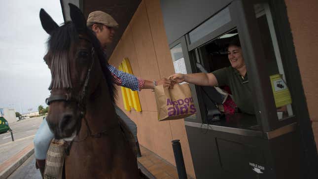 man on horse in McDonald's drive-thru