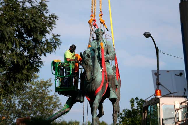 Workers remove the monument of Confederate Gen. Robert E. Lee on July 10, 2021, in Charlottesville, Va. On Monday, Jan. 9, 2023, a Virginia judge dismissed an argument that Charlottesville violated an open government law with its 2021 vote to give the statue of Lee to an African-American heritage center that plans to melt it down and turn it into a new piece of public art.