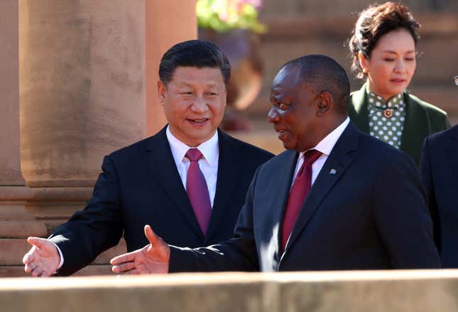 “No, you first.” Xi Jingping with South Africa’s president Cyril Ramaphosa (Reuters/Mike Hutchings)
