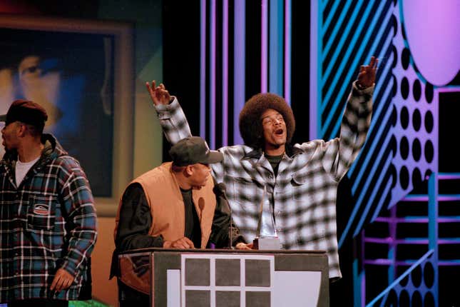 Dr. Dre and Snoop Doggy Dogg react after Dre won favorite artist and new artist in rap-hip hop at the 21st annual American Music Awards in Los Angeles, Feb. 7, 1994.