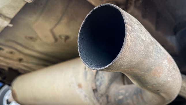 A photo of the tailpipe on a car. 