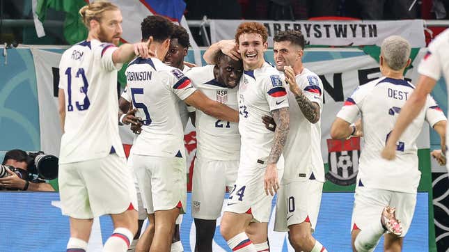 The USMNT celebrates Tim Weah’s goal in their group stage opener at the World Cup in Qatar.