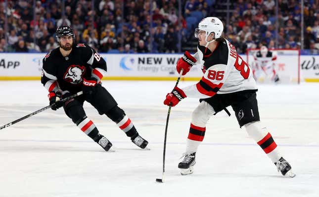 Mar 24, 2023; Buffalo, New York, USA;  Buffalo Sabres right wing Alex Tuch (89) watches as New Jersey Devils center Jack Hughes (86) makes a pass during the third period at KeyBank Center.