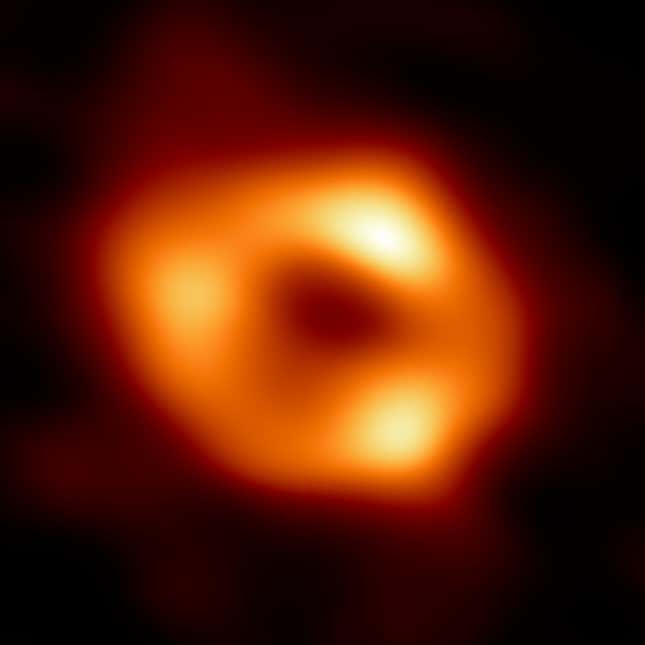 A bright ring surrounds a dark void in this Event Horizon Telescope image of Milky Way's central black hole.