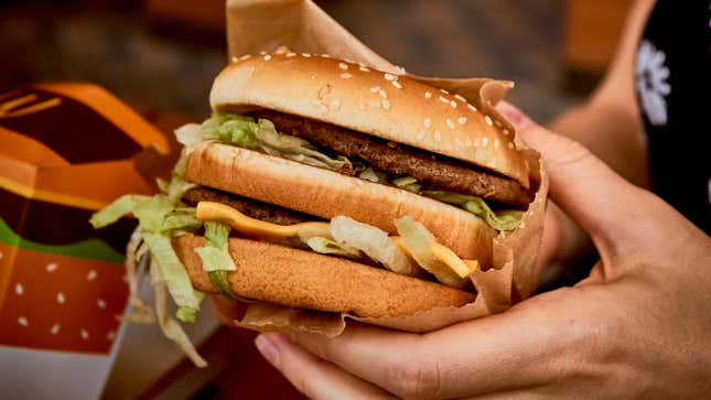 Woman holding a McDonald's Big Mac