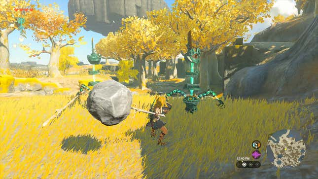 Link fuses a stick with a boulder in Zelda: Tears of the Kingdom, Nintendo's upcoming open-world exclusive for Nintendo Switch.