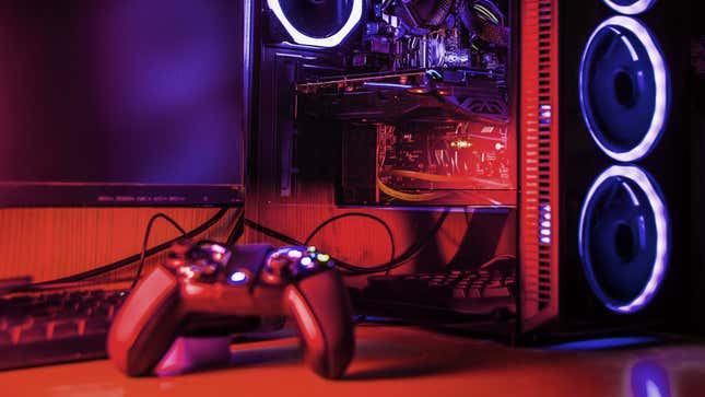 A PC and controller bathes in the glow of LED lights.