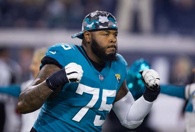 Jan 14, 2023; Jacksonville, Florida, USA; Jacksonville Jaguars offensive tackle Jawaan Taylor (75) against the Los Angeles Chargers during a wild card playoff game at TIAA Bank Field.
