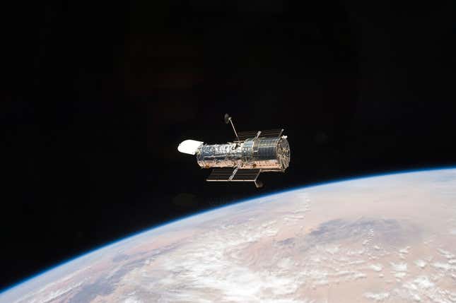 The Hubble Space Telescope orbiting Earth.