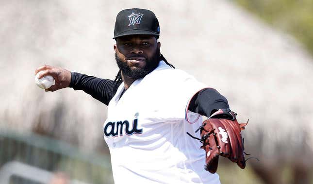 Feb 26, 2023; Jupiter, Florida, USA;  Miami Marlins starting pitcher Johnny Cueto (47) throws out St. Louis Cardinals Jose Fermin (35) in the second inning at Roger Dean Stadium.