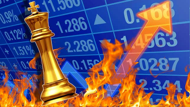 A golden chess piece stands in front of a burning business chart