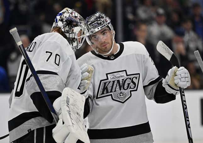 Apr 10, 2023; Los Angeles, California, USA;  Los Angeles Kings goaltender Joonas Korpisalo (70) is congratulated by Los Angeles Kings defenseman Sean Walker (26) after defeating the Vancouver Canucks at Crypto.com Arena.