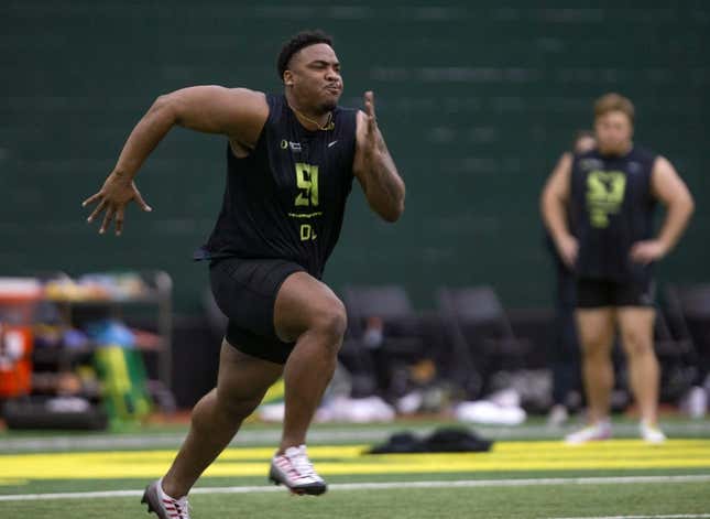 Defensive lineman Jordon Riley runs during Oregon Pro Day at the Moshofsky Center Tuesday March 14, 2023.

Eug 031423 Pro Day 03