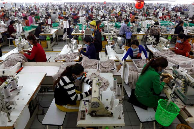 Employees work at a factory supplier of the H&M brand in Kandal province, Cambodia, December 12, 2018. REUTERS/Samrang Pring TPX IMAGES OF THE DAY - RC155EC70460