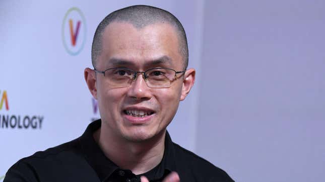 Binance founder Changpeng Zhao looks past the camera with a smile on his face.