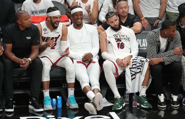 May 21, 2023; Miami, Florida, USA; Miami Heat guard Gabe Vincent (2), forward Jimmy Butler (22) and forward Caleb Martin (16) on the bench during the second half against the Boston Celtics in game three of the Eastern Conference Finals for the 2023 NBA playoffs at Kaseya Center.