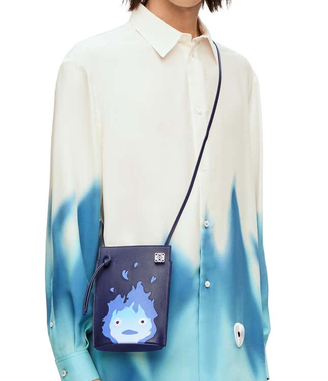 A screenshot of a dice pouch-style navy purse with a blue Calcifer on it.