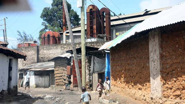 The lead-acid battery smelter, visible in the background of this photo, lead to a mass poisoning in Owino Uhuru, a village in Mombasa, Kenya’s second-largest city.