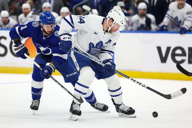 Apr 29, 2023; Tampa, Florida, USA; Toronto Maple Leafs defenseman Morgan Rielly (44) keeps the puck from Tampa Bay Lightning center Anthony Cirelli (71) in the first period  during game six of the first round of the 2023 Stanley Cup Playoffs at Amalie Arena.
