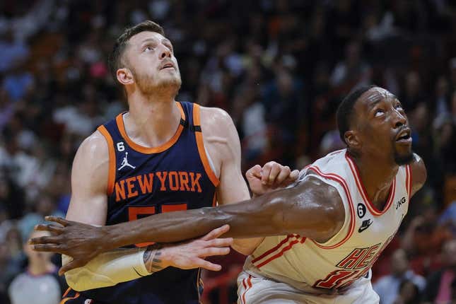 Mar 22, 2023; Miami, Florida, USA; New York Knicks center Isaiah Hartenstein (55) and Miami Heat center Bam Adebayo (13) defend during a free-throw attempt in the second quarter at Miami-Dade Arena.
