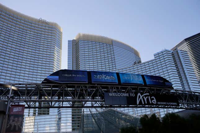 FILE - A tram travels by the front of the Aria Resort &amp; Casino, Thursday, Aug. 14, 2014, in Las Vegas. A former operations manager at the Las Vegas Strip resort is facing 15 felony charges alleging he siphoned more than $773,000 in hotel refunds into a personal account that he used for luxury shopping, expensive dinners, spa treatments and private jet flights. Brandon Rashaad Johnson, 38, of Las Vegas remained jailed Friday, Sept. 8, 2023, following his arrest Sept. 1. (AP Photo/John Locher, File)