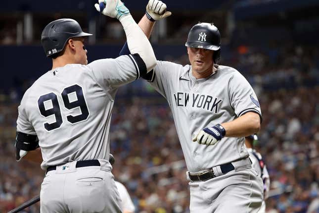 Aug 25, 2023; St. Petersburg, Florida, USA; New York Yankees third baseman DJ LeMahieu (26) celebrates with right fielder Aaron Judge (99) after he hit a home run against the Tampa Bay Rays during the fifth inning at Tropicana Field.