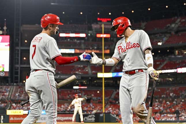 Sep 16, 2023; St. Louis, Missouri, USA;  Philadelphia Phillies right fielder Nick Castellanos (8) celebrates with shortstop Trea Turner (7) after scoring against the St. Louis Cardinals during the ninth inning at Busch Stadium.
