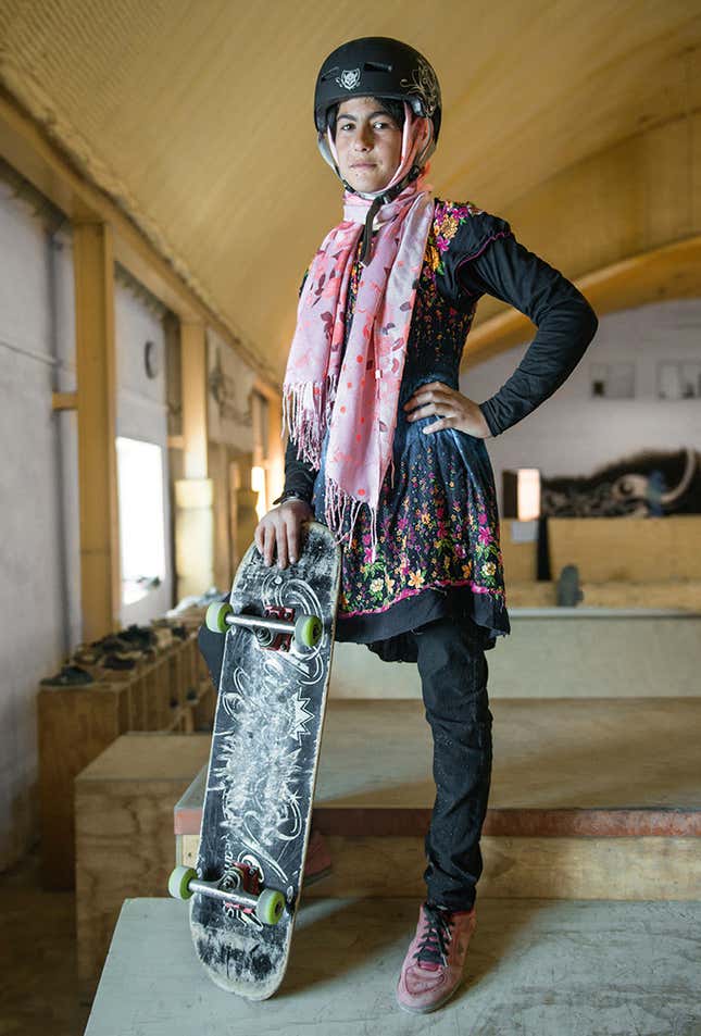 Image for article titled Photos: Forbidden from riding bikes, fearless Afghan girls are skateboarding around Kabul