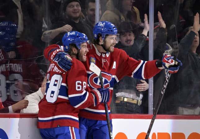 Mar 7, 2023; Montreal, Quebec, CAN; Montreal Canadiens forward Mike Hoffman (68) celebrates with teammate forward Josh Anderson (17) after scoring a goal against the Carolina Hurricanes during the first period at the Bell Centre.